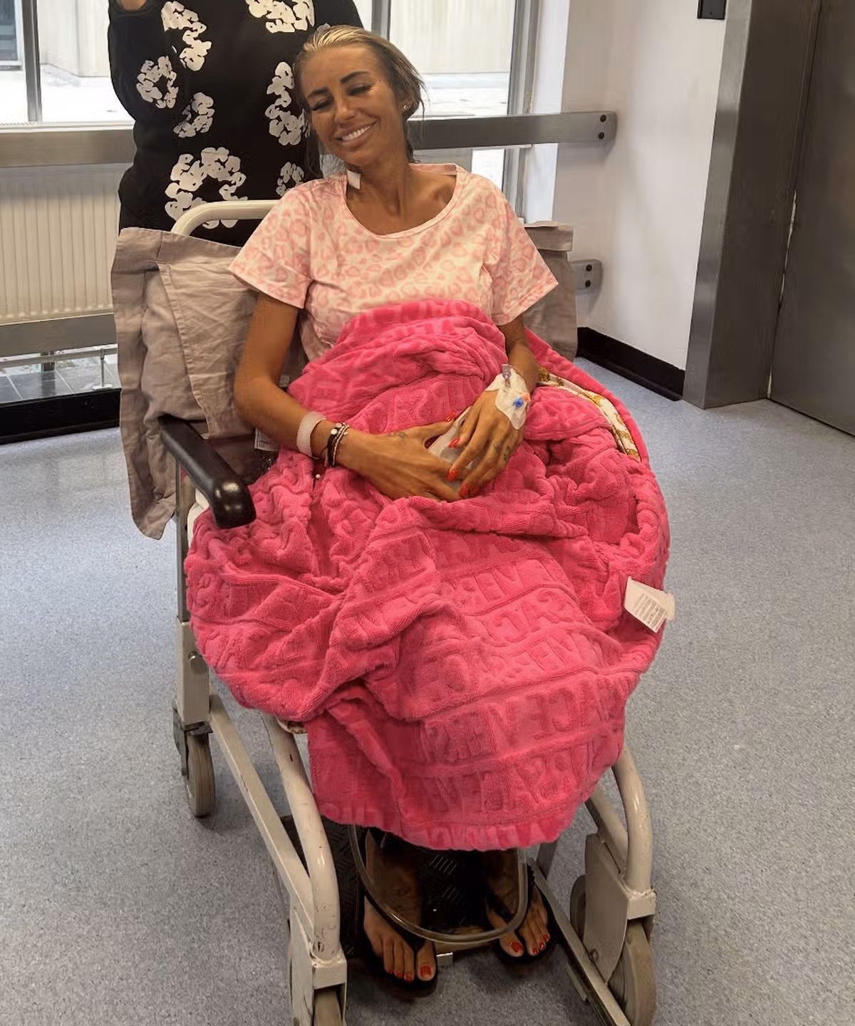 Smiling Cydnie in wheelchair after her operation