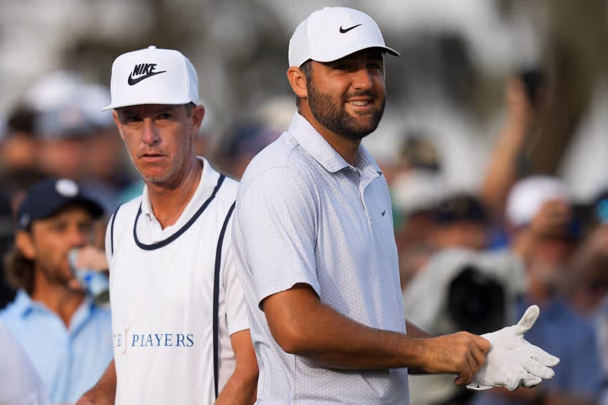 PONTE VEDRA BEACH, FLORIDA - MARCH 12: Scottie Scheffler and his caddie Ted Scott look on before playing the 10th hole during the first round of THE PLAYERS Championship at Stadium Course at TPC Sawgrass on March 12, 2026 in Ponte Vedra Beach, Florida. (Photo by Ben Jared/PGA TOUR via Getty Images)