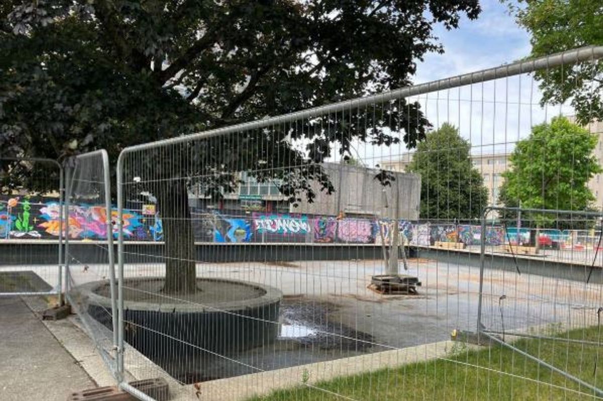 The fenced off pond in Civic Square