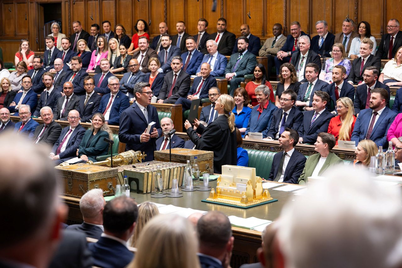 British new Member of Parliament for Makerfield, Andy Burnham, is sworn in at the House of Commons, in London, on June 22.