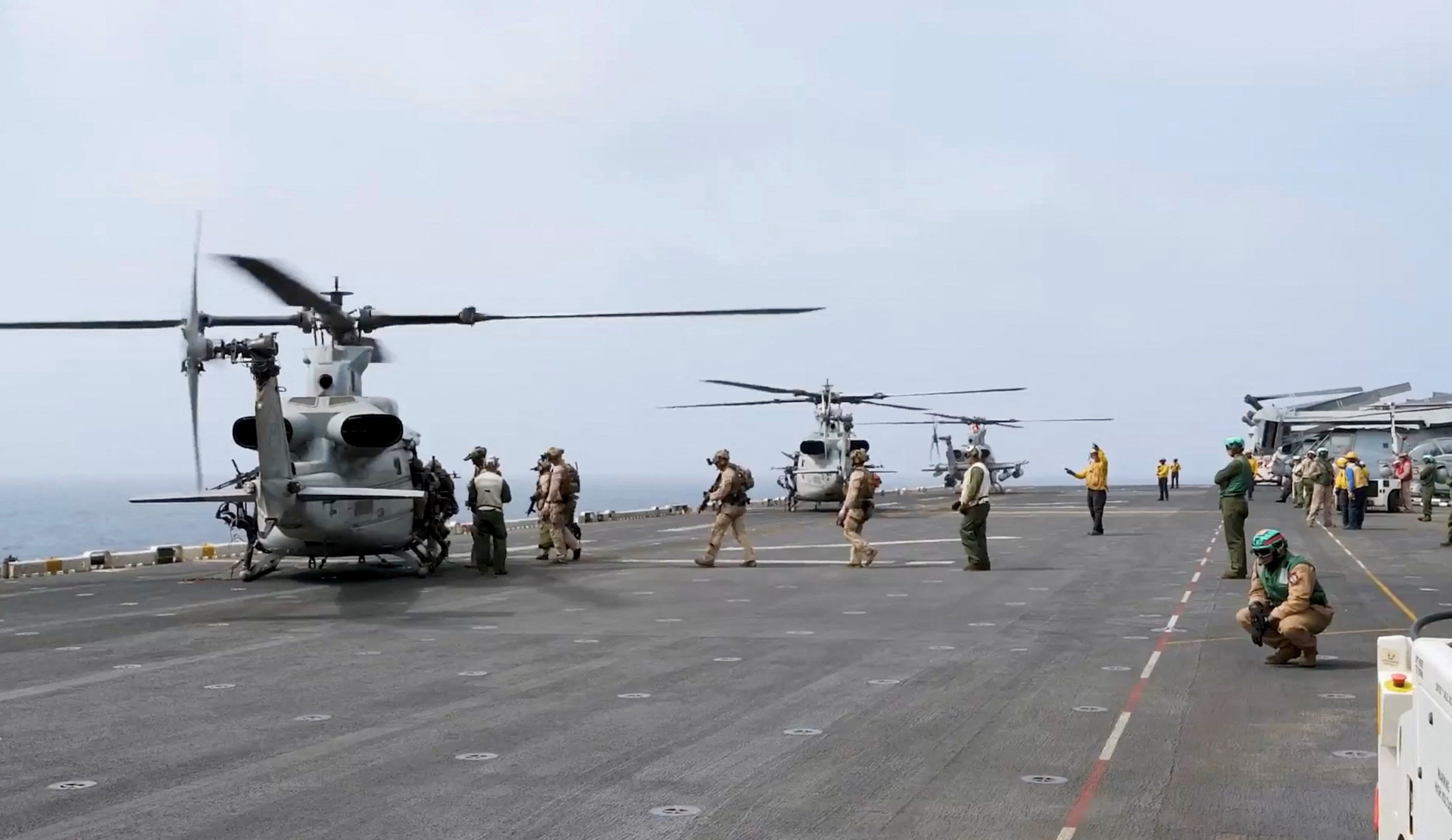 Military helicopters and personnel operate in a location given as the Arabian Sea in this screengrab obtained from a video released by U.S. Central Command (CENTCOM) on July 25, 2026.
