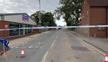 Two Lowestoft roads closed after man climbs onto roof