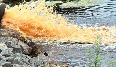 Bright orange water from disused reservoirs near treatment works