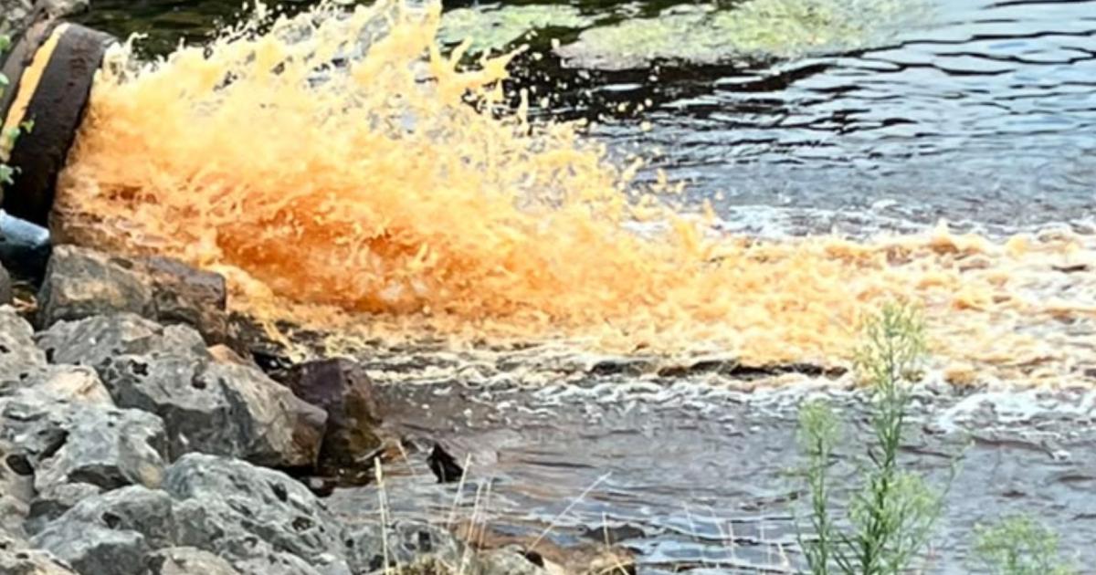 Bright orange water from disused reservoirs near treatment works