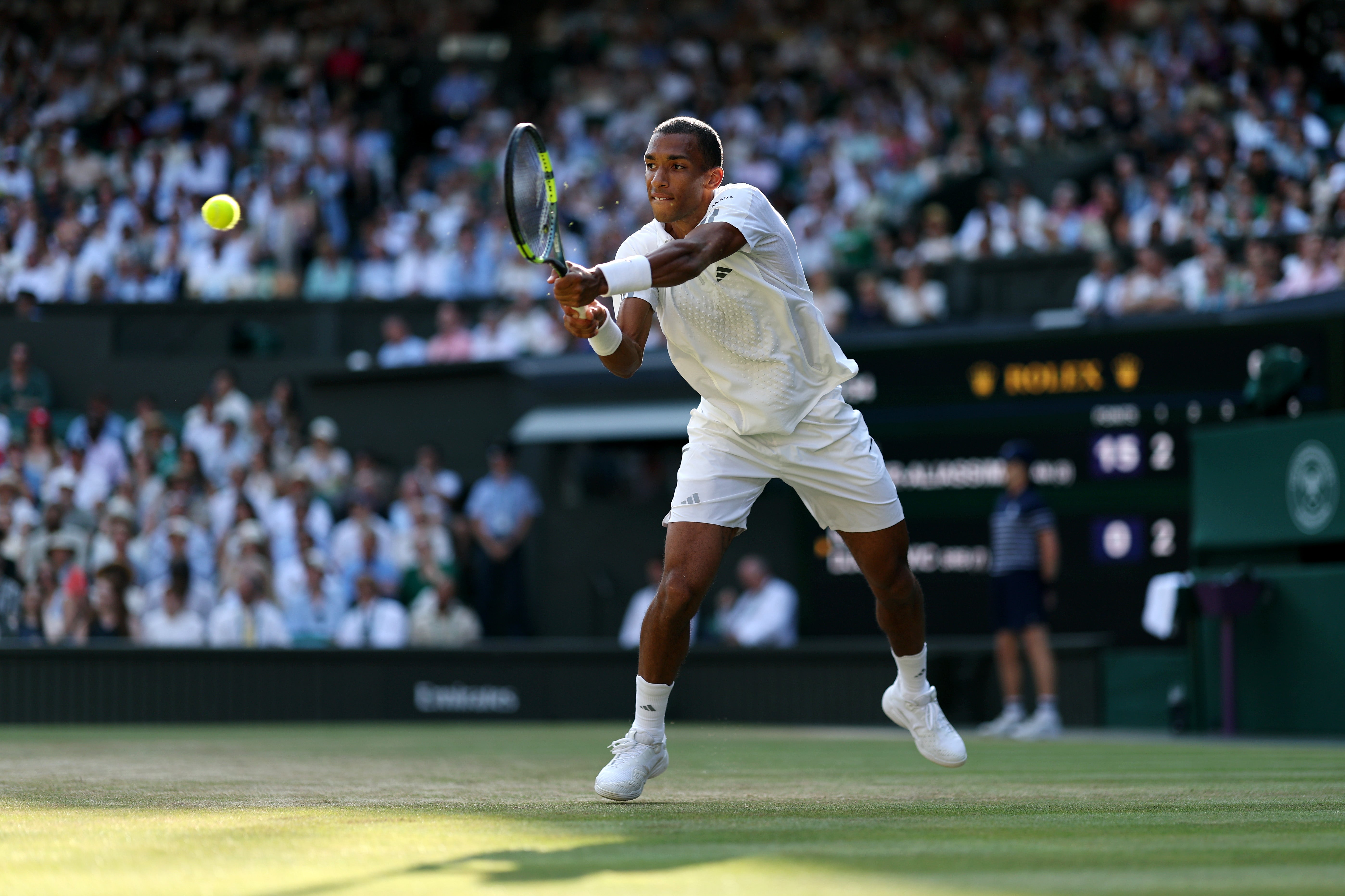 Auger-Aliassime holds to love