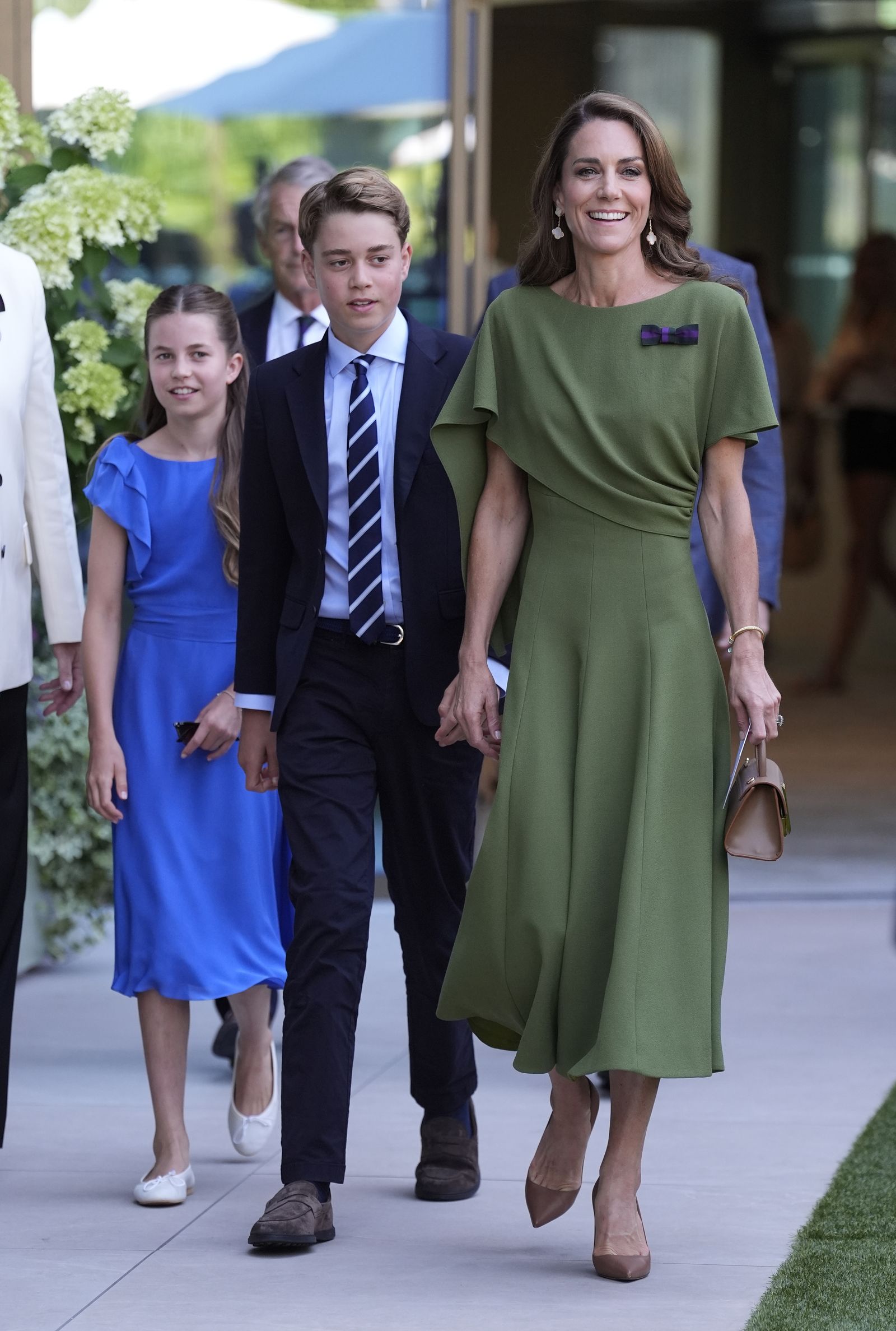 Image may contain Prince George of Cambridge Person Adult Accessories Formal Wear Tie Clothing Coat Bag and Handbag