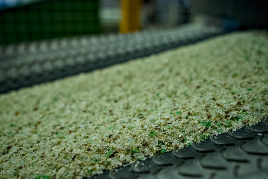 Shards of glass on a factory processing belt.
