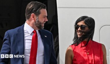 JD Vance and his wife Usha Vance disembark from an aircraft and smile at each other