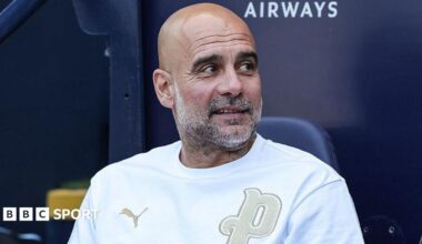 Pep Guardiola sat in the dugout at Etihad Stadium during his time in charge of Manchester City
