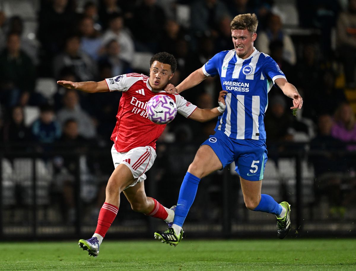 Sebastian Ferdinand of Arsenal challenges Charlie Penman of Brighton during the PL2 match between Arsenal U21 and Brighton & Hove Albion U21 at Meadow Park