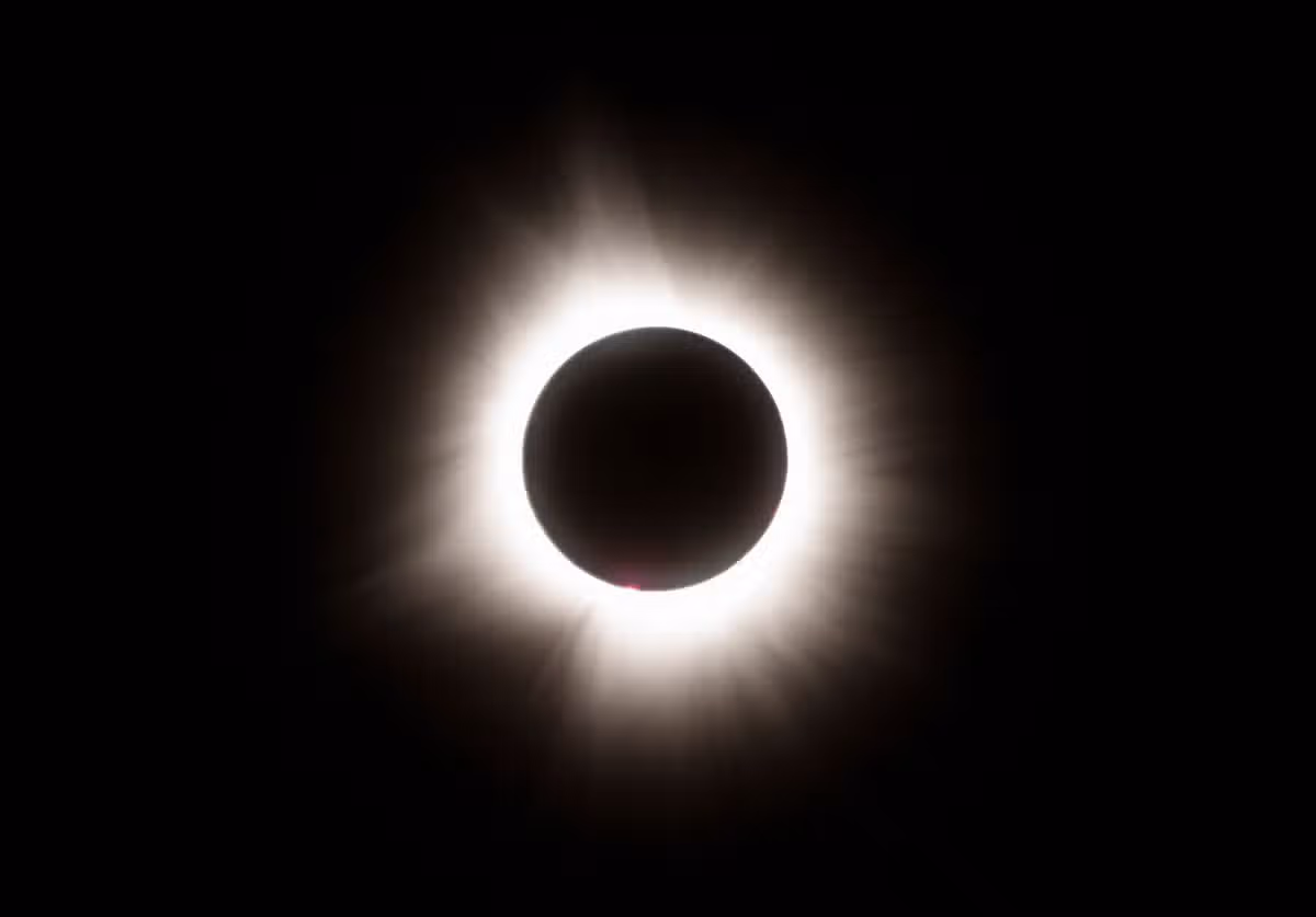 The moon crosses in front of the sun during the Great North American Solar Eclipse