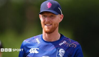 Ben Stokes holds his bat out in celebration as he hits a century against Derbyshire