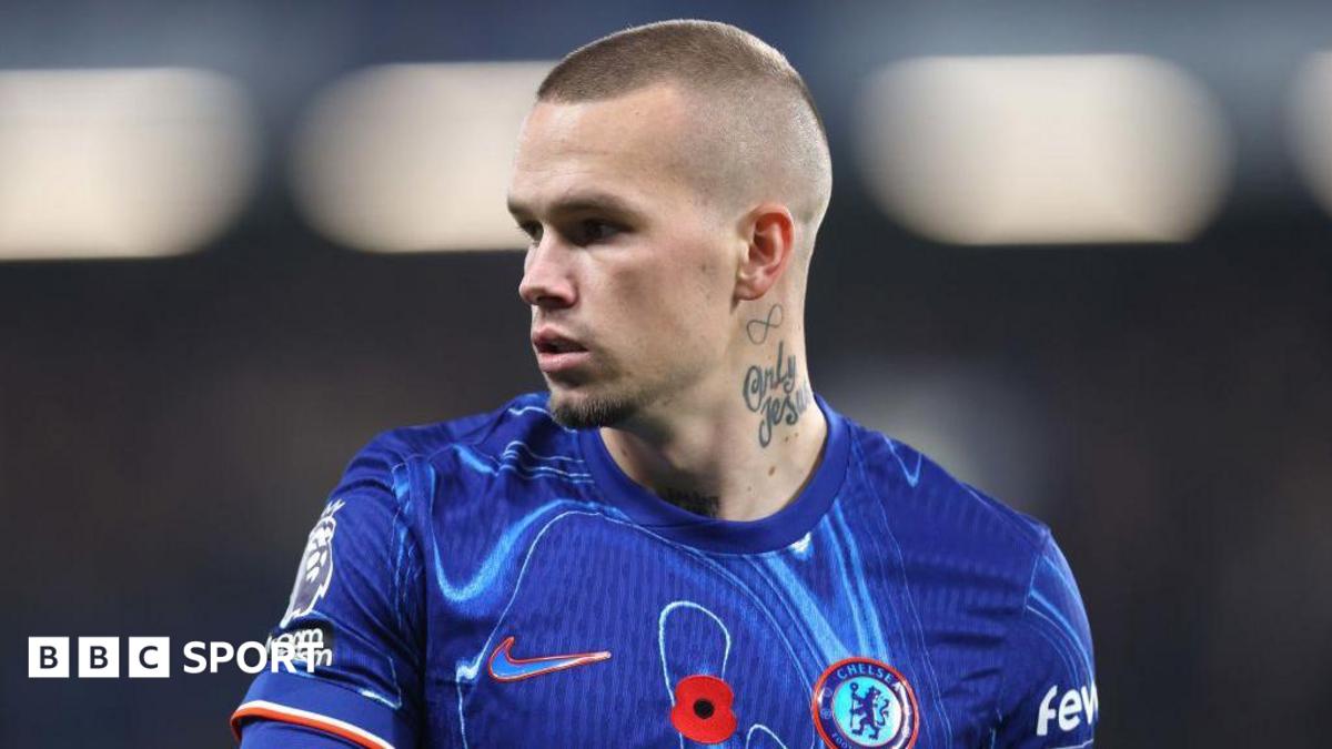 Mykhailo Mudryk looking to his right while playing in a Chelsea kit