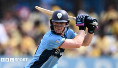 Right-handed Brooke Guest plays a shot through the covers in blue Derbyshire kit