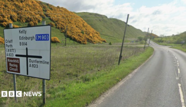 A Google view of a road sign next to a country road