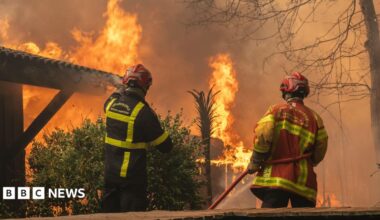 A firefighting crew deployed to battle a wildfire spreading in Lege-Cap-Ferret, south western France, late 24 July 2026.