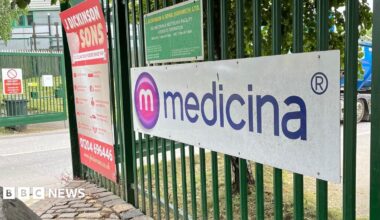 The green gate to the entrance of manufacturer Medicina Ltd in Blackrod, Bolton, which provides neonatal medical devices.