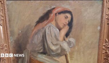 A painting believed to be by artist Stanhope Alexander Forbes. It shows a woman sat on a stool leaning on a broom. It's a golden coloured frame in front of a white wall.