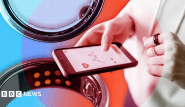 A designed image showing a woman (face not shown) wearing an Oura ring and looking at health stats on her phone; on the left is a larger image of the ring. It's set against a background of blue, purple and red circles.