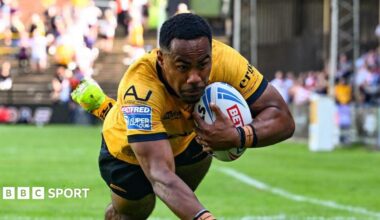 Castleford Tigers' Jason Qareqare diving for the line with the ball in his left hand.