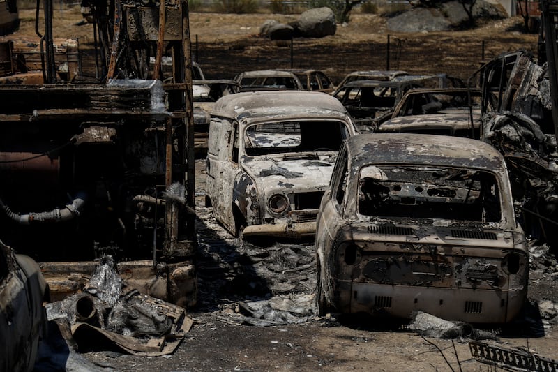 Vehicles are burnt out in an industrial area following wildfires Monday in Chapinería, in Madrid province, Spain. Photograph: Getty Images