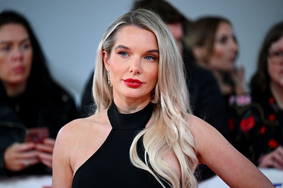 Helen Flanagan in red lipstick and a black dress while at the O2 Arena in London 