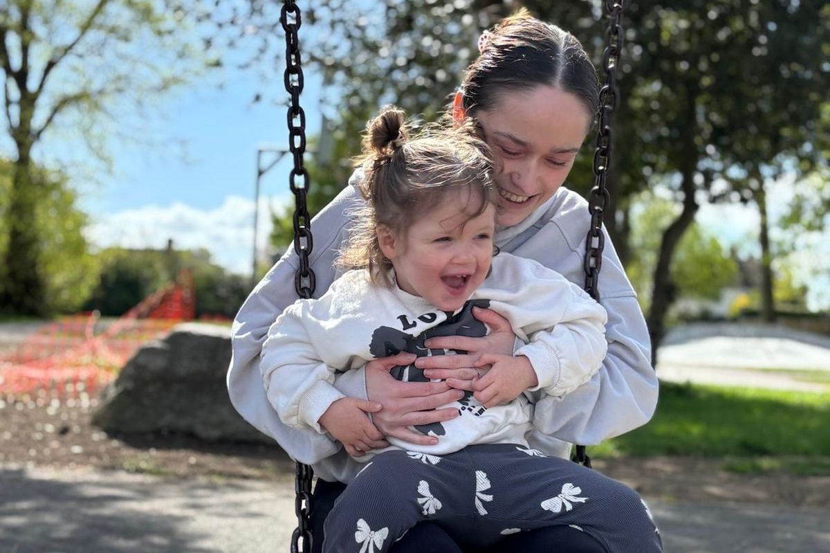 Emily and daughter Harriet on a swing