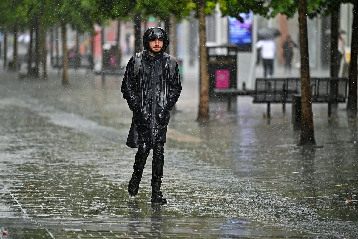 Members of the public make their way through the rain on Sauchiehall Street, Glasgow