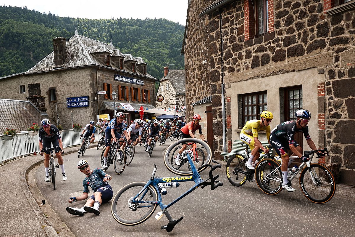 Belgian rider Wout Van Aert crashes in the Col de Neronne ascent during the 11th stage of the 111th edition of the Tour de France on July 10 2024