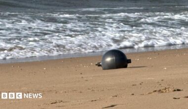 One of the six mysterious large silver spheres washed up on Forrest Beach in Queensland.