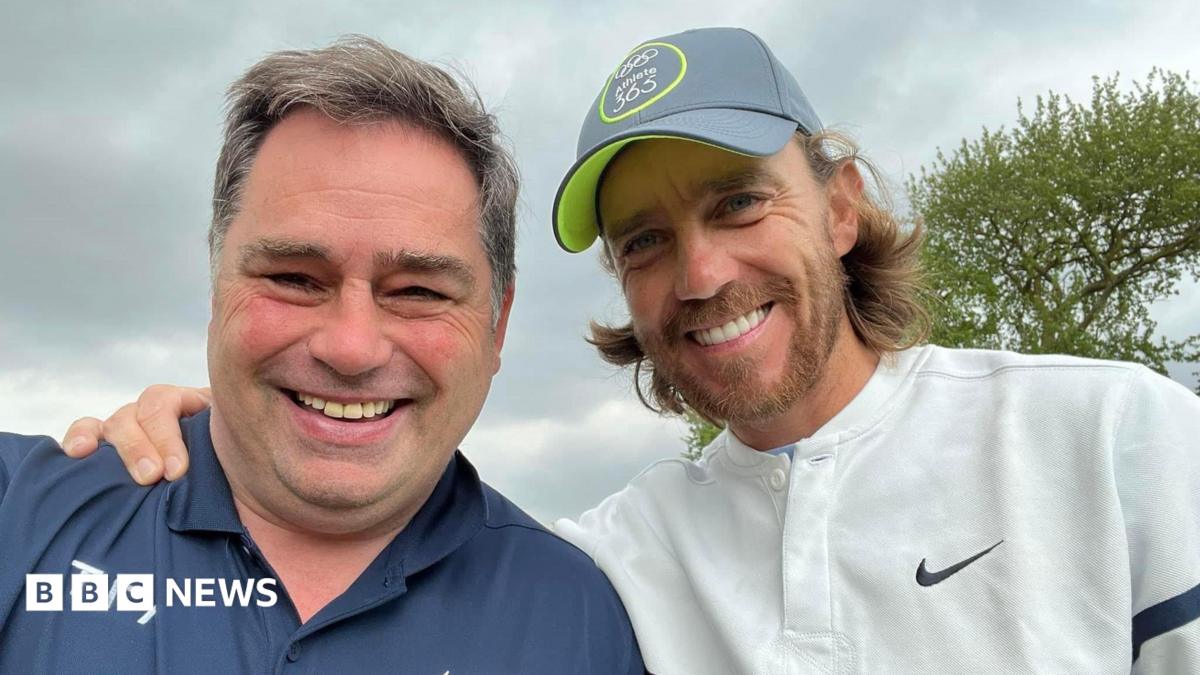 Norman and Tommy smiling in a selfie.