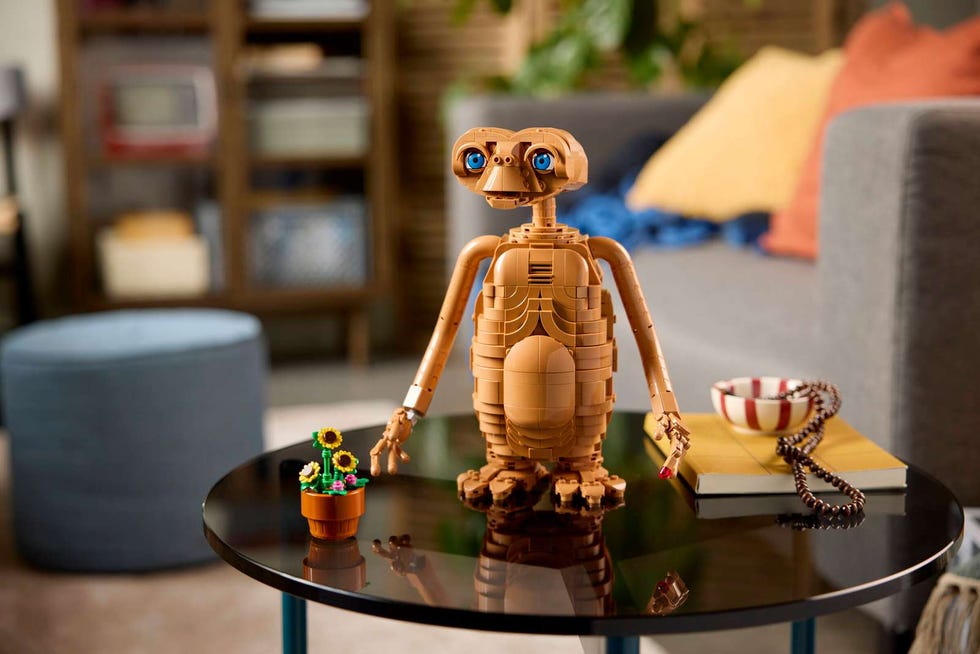 ET the Extra-Terrestrial LEGO set lego brick et alien figure on table next to small flower pot