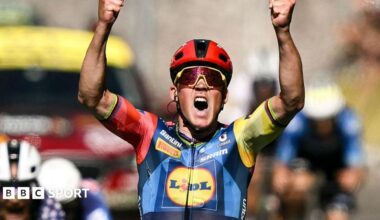 Torstein Traeen celebrates on the podium with the overall leader's yellow jersey after the fourth stage of the 113th edition of the Tour de France