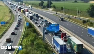CCTV cameras capture traffic congestion on the M6 motorway in Warrington, Cheshire.