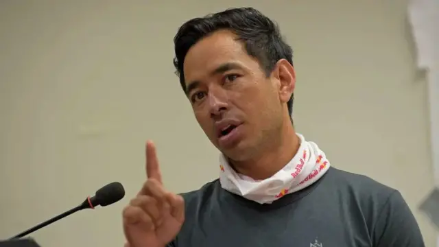 Nirmal Purja speaks into a microphone