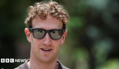 Meta CEO Mark Zuckerberg walking outside wearing a polo-style shirt and a pair of his company's camera-enabled sunglasses.