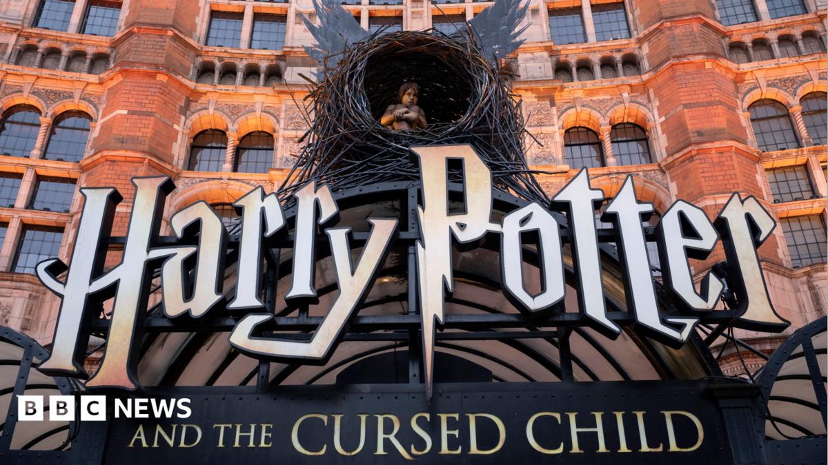 Harry Potter and the Cursed Child sign with boy inside a nest with wings outside a red brick building