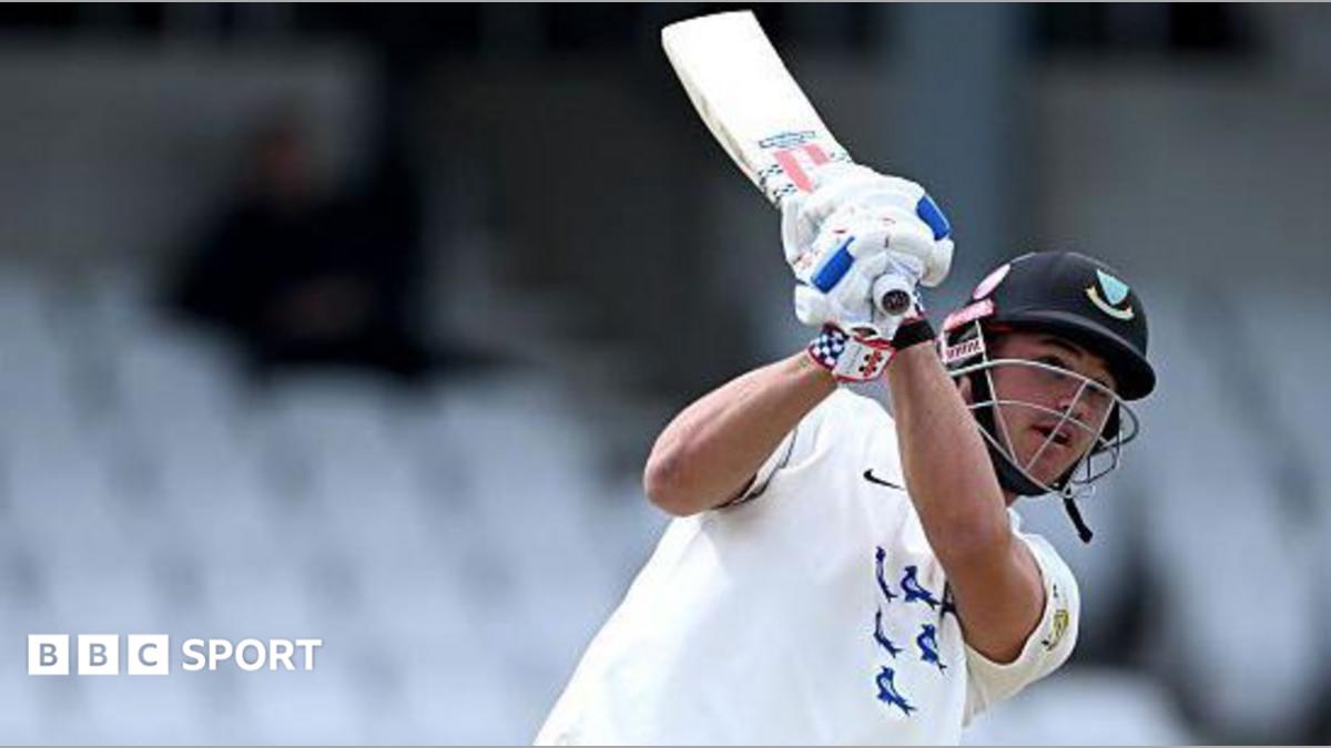 Sussex batter Tom Clark in all white with bat in backlift after a shot