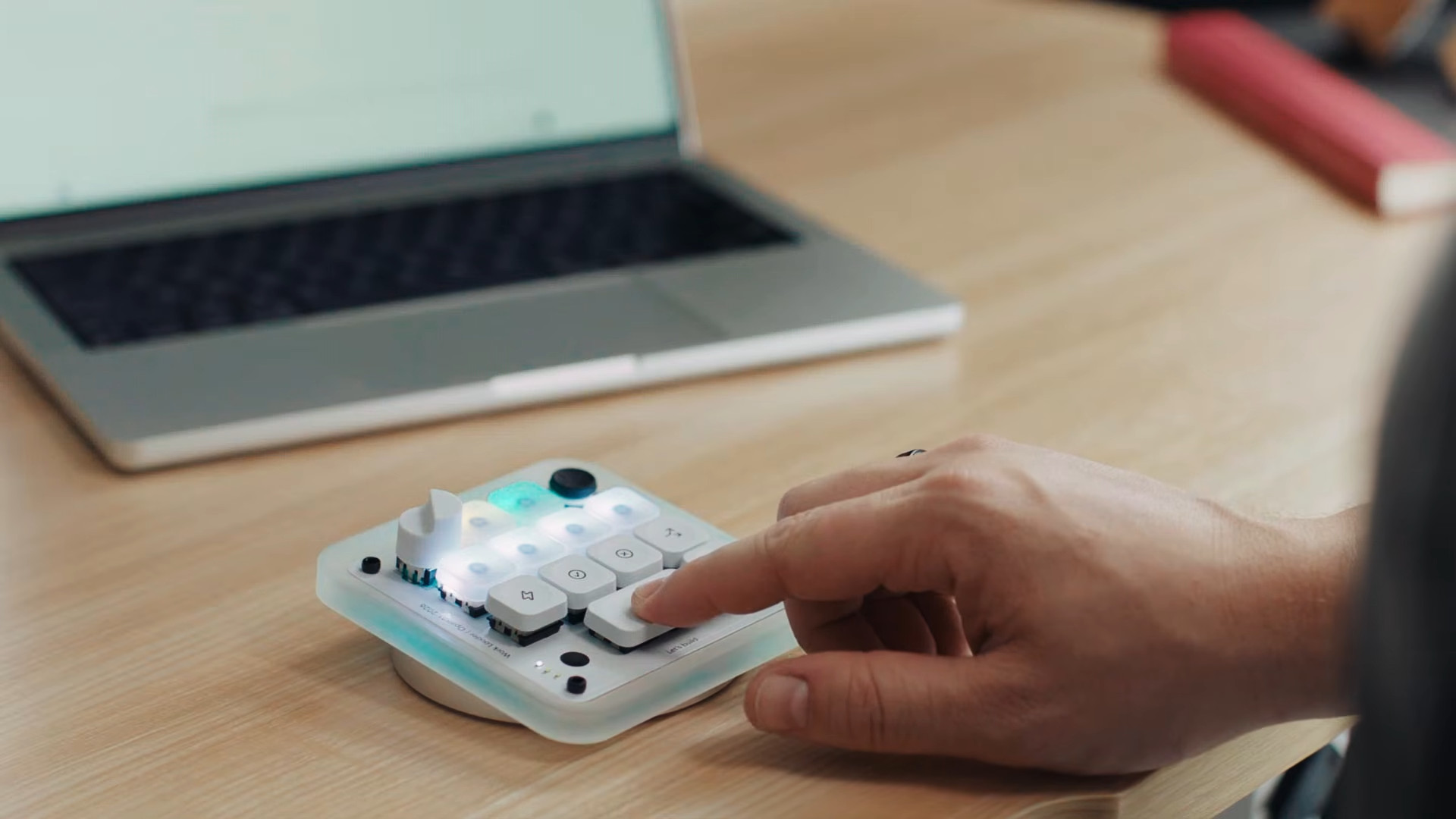 Codex Micro being used with a person pressing the mic button