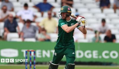 Lyndon James in the dark green kit of Notts Outlaws, plays a shot