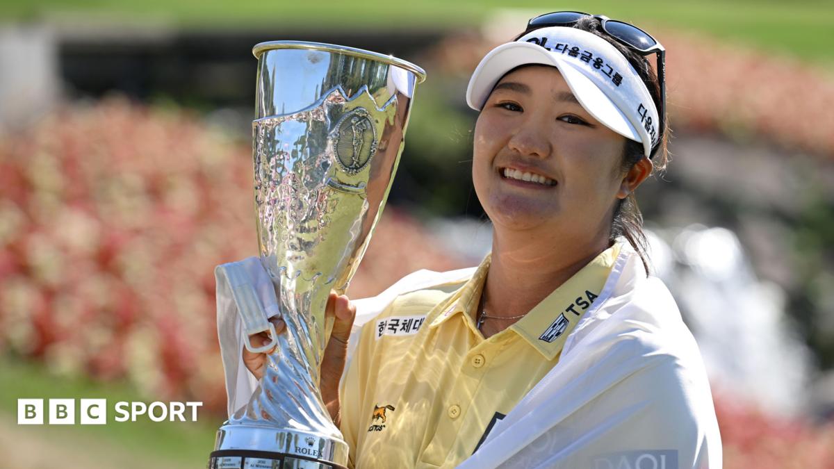 Haeran Ryu lifts the Evian Championship trophy