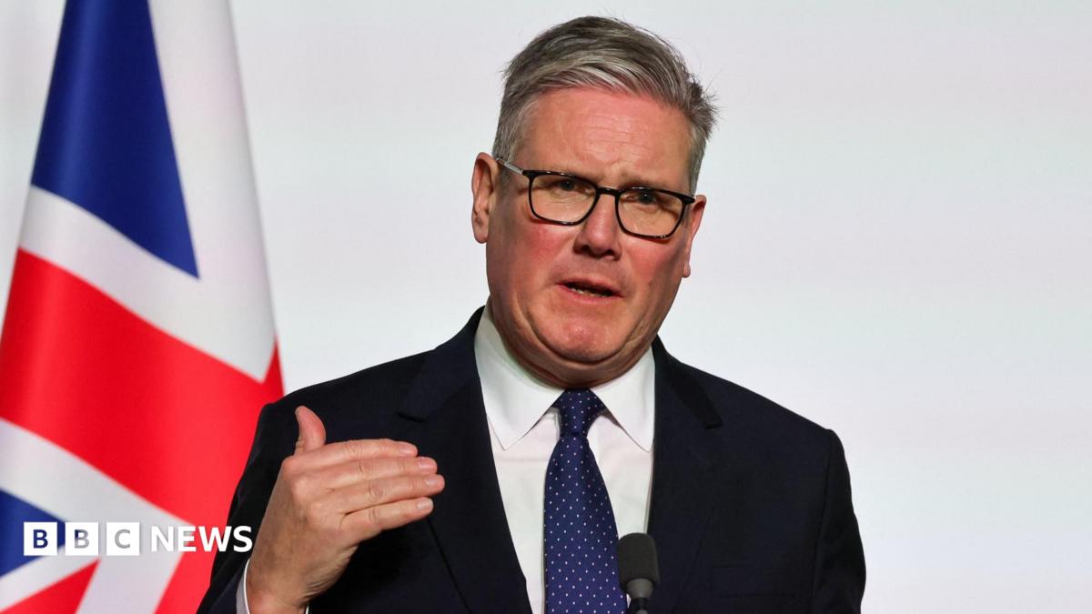 Sir Keir Starmer in front of a UK flag
