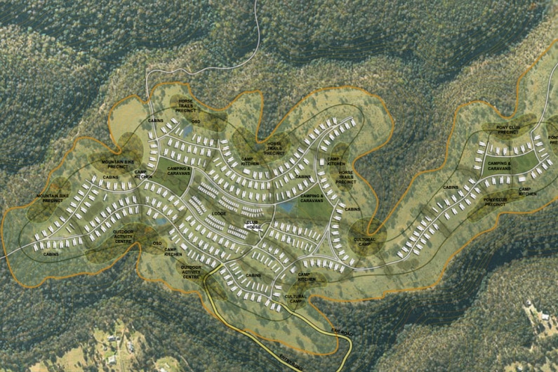 a design map showing dozens of white buildings and roads in a forested area