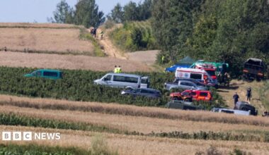 Emergency services work at the site where an unidentified flying object, believed to be a Russian cruise missile, as Ukraine's foreign minister said on Thursday, fell after violating Polish airspace