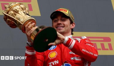 Ferrari's Charles Leclerc crosses the line to win the British Grand Prix with Mercedes George Russell and Ferrari's Lewis Hamilton behind him