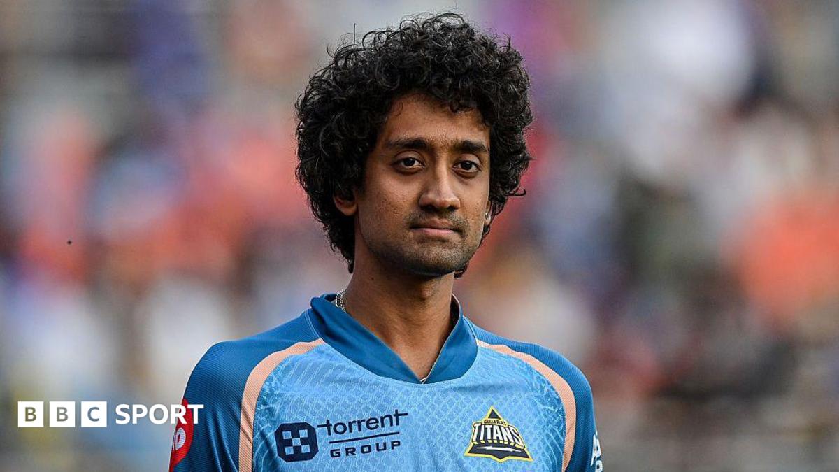 R Sai Kishore standing on the pitch wearing a jersey for Gujarat Titans during a match in 2025