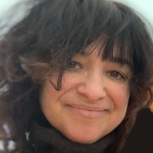 Profile image of color expert, Amy Krane. It is a close-up image of a woman with brown hair and fringe.