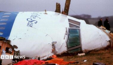 Officials inspect the wreckage of Pan Am flight 103 December 21, 1988 in Lockerbie, Scotland.