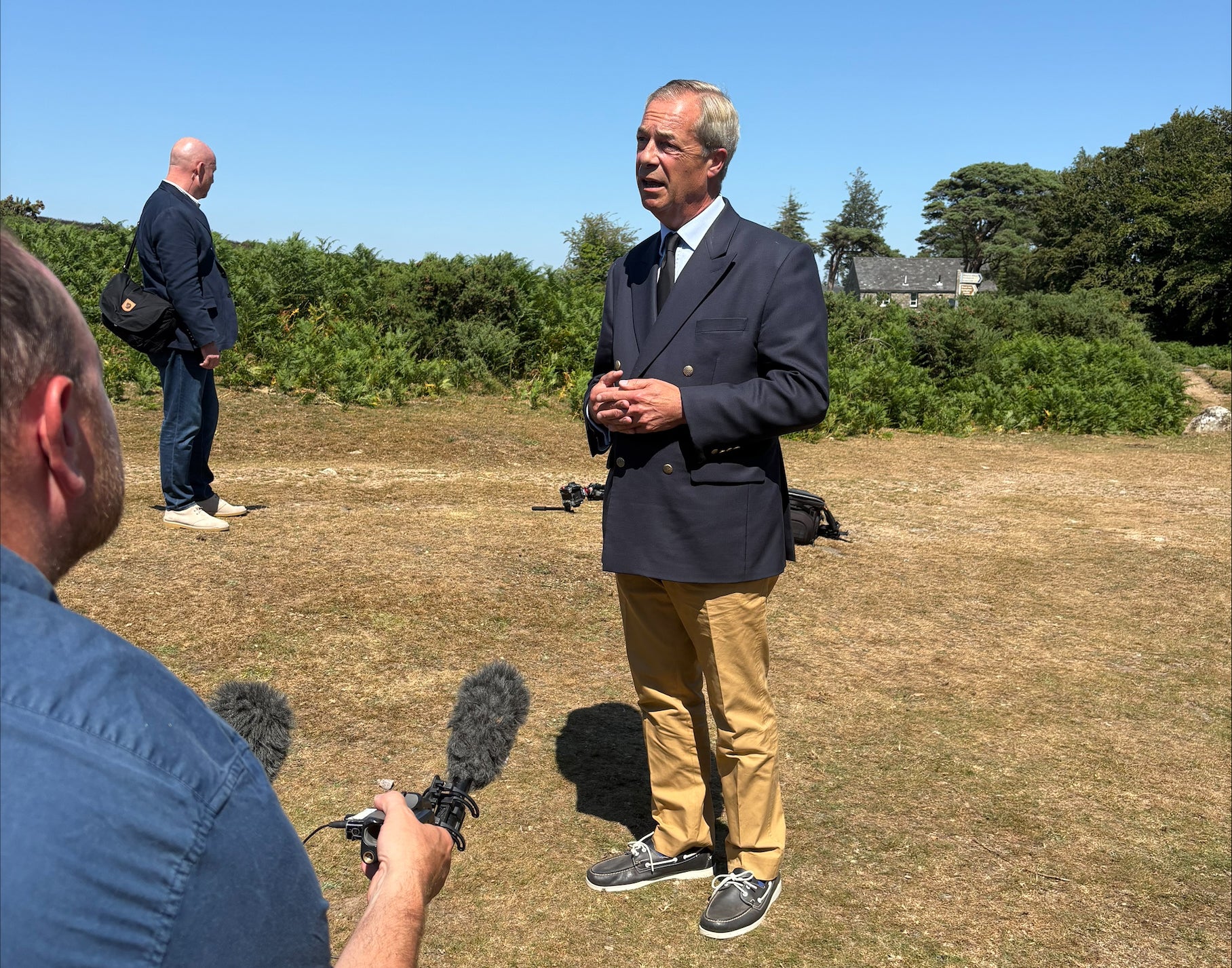 Reform UK leader Nigel Farage speaking to the media after he laid a wreath near to the home of Ann Widdecombe (Eleanor Storey/PA)