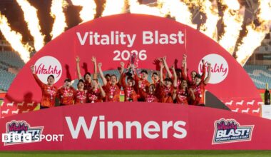 The Blaze team lift the T20 Blast trophy with flames in the background